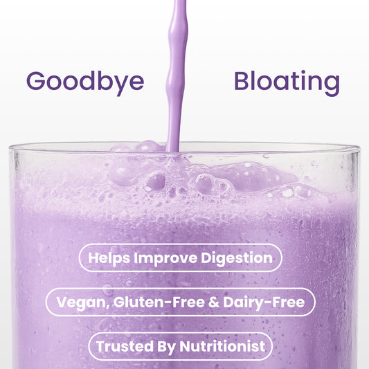 40793201049649 A clear glass filled with light purple liquid, with more of the same purple drink being poured into it. White text overlays read 'Goodbye Bloating' and additional claims like 'Helps Improve Digestion,' 'Vegan, Gluten-Free & Dairy-Free,' and 'Trusted By Nutritionist.