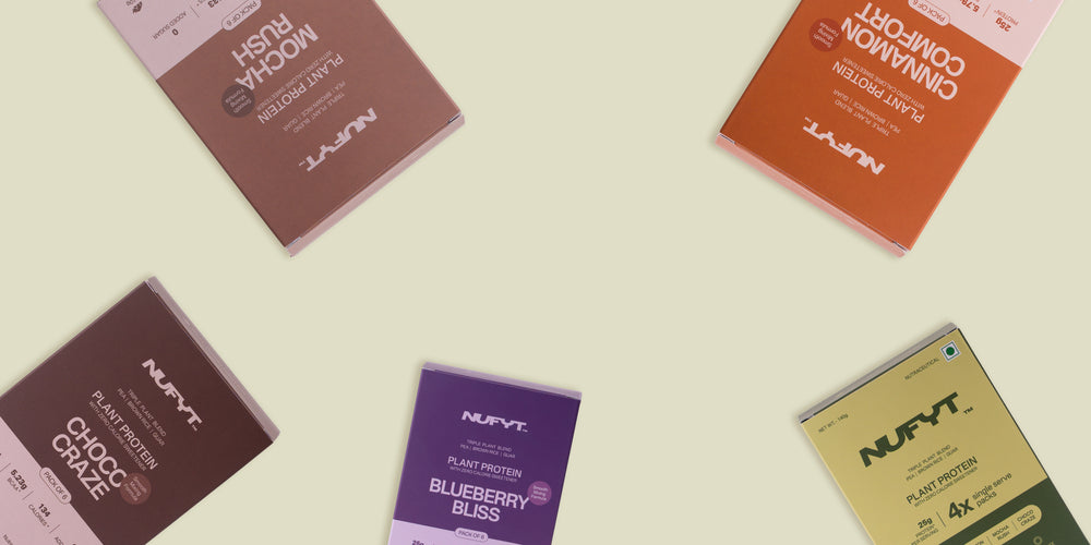 Five colourful NUFYT plant protein bar boxes—Mocha Rush, Choco Craze, Blueberry Bliss, Cinnamon Comfort, and a pack of 4 flavour—are spread out on a light beige background.